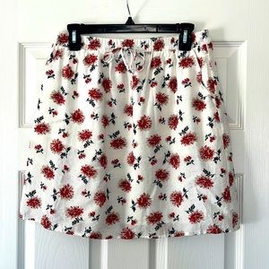 Skies are blue floral lined skirt. Size medium.